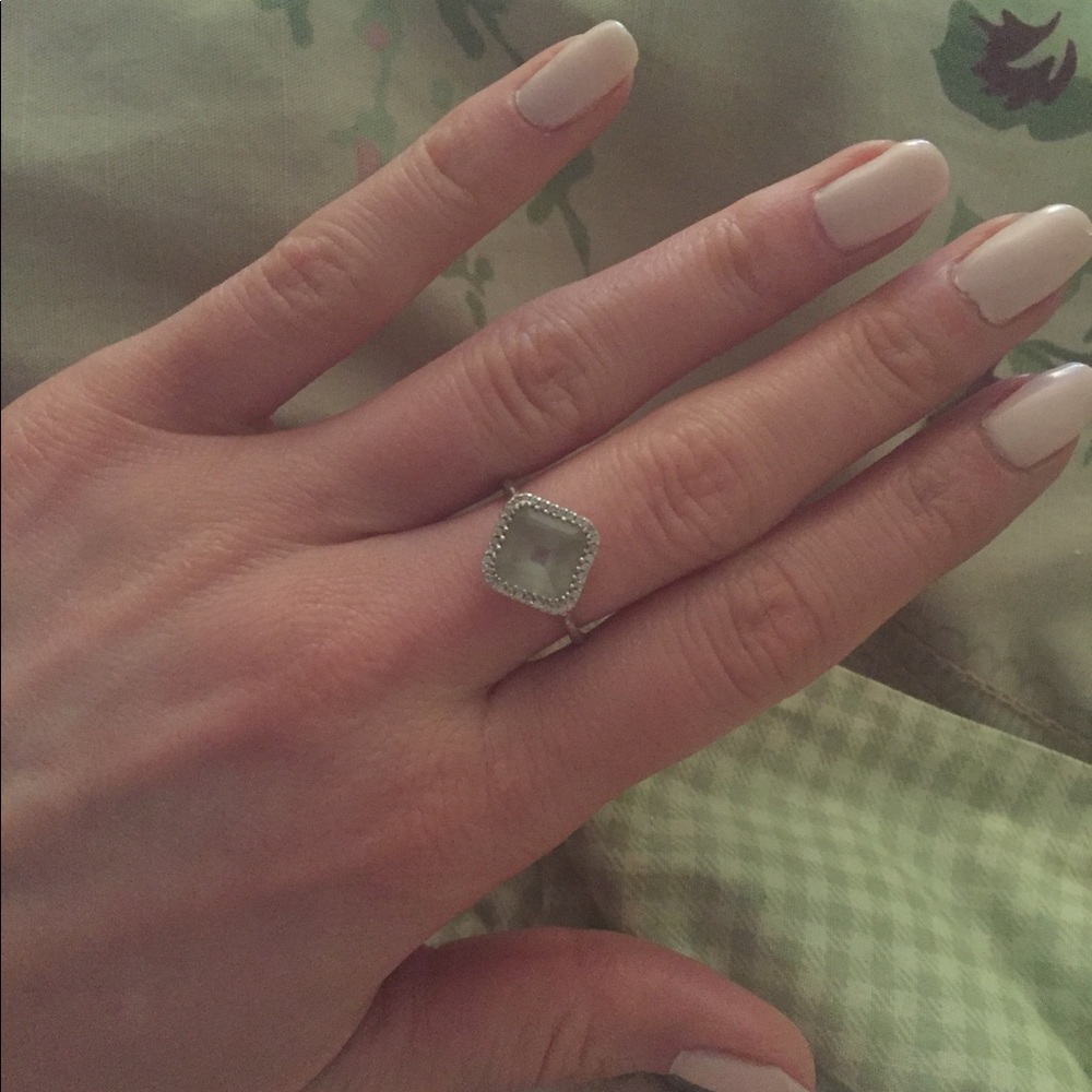 Aqua blue gem with surrounding diamonds